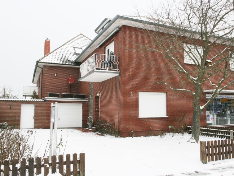 Foto van exterieur van Appartement Norddeichin de winter